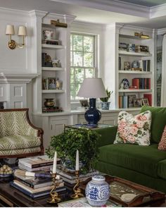 a living room filled with furniture and bookshelves