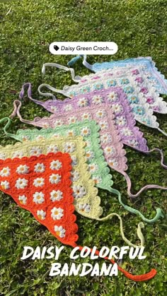 three crocheted grannys are laying on the grass with text overlay that reads daisy