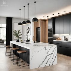 a kitchen with marble counter tops and black cabinets