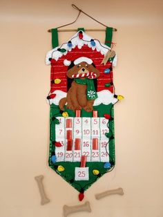 a christmas stocking hanging on the wall with a teddy bear and santa's hat