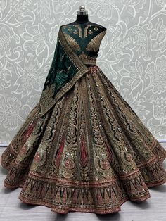 Introducing our stunning "beautiful green thread work velvet lehenga choli with double dupatta" - a true masterpiece that will make you feel like a princess on your special day. This exquisite bridal lehenga is crafted with utmost precision, using the finest green color velvet material that is known for its luxurious and elegant appeal. It is adorned with intricate mirror work, diamond motif work, zari work, and thread embroidery work, adding a touch of opulence to the overall design. Additional Anarkali Wedding Velvet Lehenga, Anarkali Velvet Lehenga For Wedding, Heavy Anarkali Dupatta With Traditional Drape, Green Velvet Traditional Wear With Traditional Drape, Green Velvet Dupatta With Zari Work, Green Velvet Dupatta In Traditional Drape, Anarkali Velvet Lehenga With Pallu, Green Velvet Dupatta With Resham Embroidery, Velvet Lehenga With Zari Work For Wedding