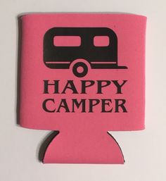 a pink flask with the words happy camper on it and a black trailer