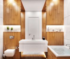 a bathroom with wood paneling and white fixtures on the walls, along with a bathtub