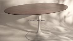 a round table with a wooden top on a white background that says,'eternity modern '