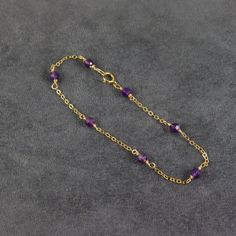 Fine chain bracelet with gemstones amethyst gemstones scattered on a 14ct gold filled chain bracelet. Looks great stacked with other bracelets. Amethyst is said to bring serenity and calm, and to enhance one's ability to assimilate new ideas. It is also said to give strength and mental stability, and to provide balance between one's physical, emotional, and intellectual states.  It is also the birthstone for February. Length - 19cm (if you need a different length, message me) Gemstones -  amethy Spiritual Amethyst Gold Bracelets, Gold Amethyst Bracelets For Healing, Gold Amethyst Beaded Bracelets For Jewelry Making, Amethyst Bracelets In Yellow Gold For Gift, Amethyst Yellow Gold Bracelets For Gift, Amethyst Yellow Gold Bracelet For Gift, Yellow Gold Amethyst Bracelets As A Gift, Gold Amethyst Gemstone Bracelets, Gold Amethyst Crystal Bracelet With Natural Stones