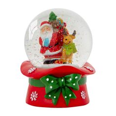 a snow globe with santa claus and other christmas decorations