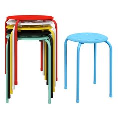 three colorful stools and one small table with four different colors on each side, all stacked together