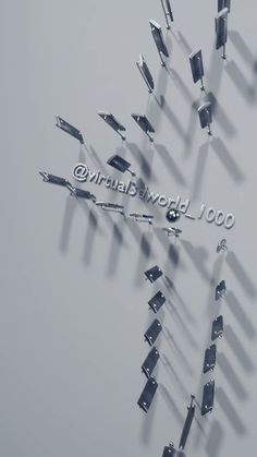 a group of metal objects floating on top of each other in the air with words that read virtual world 100