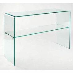 a clear glass desk with shelves underneath it