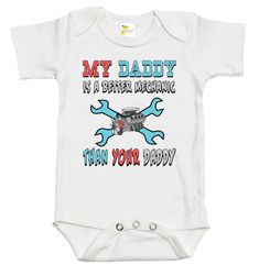 Rapunzie's adorable baby onesie with a playful and cheeky caption: "My Daddy is a Better Mechanic Than Your Daddy." Made from 100% cotton, this onesie is designed for maximum comfort and style for your little one. The onesie features short sleeves, perfect for warmer days or as a layering piece under a cozy sweater. Its soft and breathable fabric ensures that your baby stays comfortable throughout the day, making it ideal for both playtime and nap time. Available in three delightful colors, whit Baby Mechanic Photoshoot, Mechanic Nursery Theme, Funny Graphic Print Short Sleeve Bodysuit, Funny Graphic Print Onesie For Playtime, Blue Cotton Bodysuit With Letter Print, White Cotton Novelty Onesie, Cotton Onesie For Father's Day, Cotton Onesie With Funny Text And Short Sleeves, Cotton Short Sleeve Onesie With Funny Text