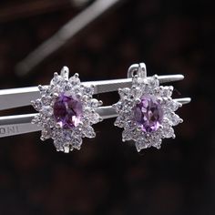 Amethyst Gemstone Earring, CZ Diamond Earring, 925 Sterling Silver Victorian Earring, Party Wear Stud Earring, Clip On Fine Earring. Manufacture Country : India * Customization always available for Ring size, metal selection and any type of center stones changes, etc.... * If you want to make your own idea of Jewelry we can do it. Material : 925 Sterling Silver Main Stone : Amethyst Secondary Gemstone : Diamond Gemstone Color :   Gemstone Shape : As Seen In A Picture Ring Size : All Size Available Weight :  * Shipment will dispatch within maximum 2-3 Days of Order done * Some Special customization can take more Time * UPS, DHL, FEDEX OR ARAMEX Will be available for Delivery Elegant Purple Clip-on Earrings, Purple Cubic Zirconia Earrings With Sparkling Stones, Purple Cubic Zirconia Earrings, Clip-on Cubic Zirconia Jewelry Gift, Purple Cubic Zirconia Round Earrings, Purple Cubic Zirconia Earrings For Anniversary, Purple Pierced Earrings For Wedding, Formal Cubic Zirconia Gemstone Hoop Earrings, Cubic Zirconia Crystal Gemstone Earrings For Anniversary