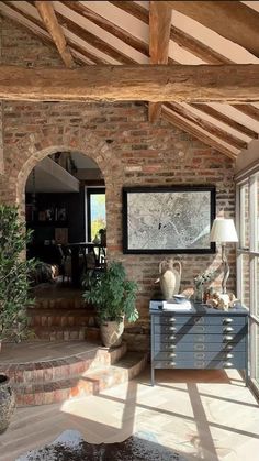 a living room filled with furniture and lots of windows