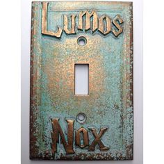 a light switch cover with the words lumos and nox on it