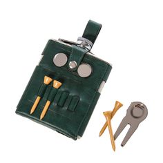 a green leather case with tools in front of it and a pair of scissors on the side