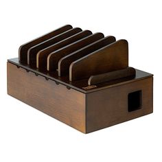 a wooden holder with six knives in it