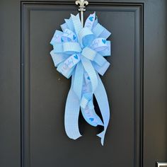 a blue bow hanging on the front door