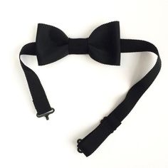 This is the bow tie every man should have in your wardrobe.The black bow tie is a timeless and it is ideal to be chic in various events. Wedding, birthday, Gala, etc.This bow as the set of bowties Prism Bowtie was made by hand in France and with love.Bow size: about 10x5cmChoker adjustable from 33 to 47 cm. Ideal to fit perfectly around your neckMake you directly on the site to see other great classics of the masculine.> www.leprismebowtie.comBow tie made in Lille. Black Tuxedo For Black-tie Events, Classic Black Tuxedo For Party, Classic Black Party Tuxedo, Dapper Adjustable Bow For Black Tie Events, Adjustable Dapper Bow For Black Tie Events, Dapper Adjustable Satin Bow Tie, Adjustable Satin Bow Tie In Dapper Style, Modern Black Suit And Tie Accessories For Formal Occasions, Dapper Bow Tie For Formal Occasions