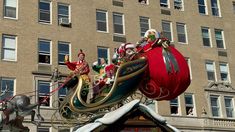 an elaborately decorated float in front of a large building