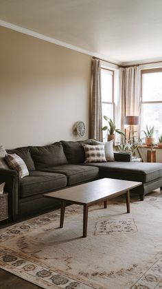 a living room filled with furniture and a large window