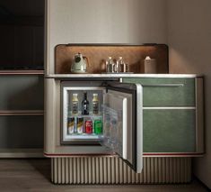 an open refrigerator with drinks inside in a kitchen