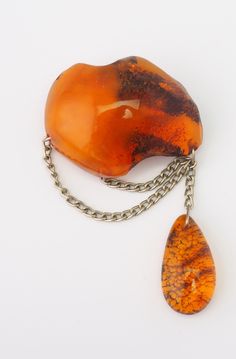 "This listing is for a unique vintage artisan natural Baltic honey amber teardrop dangle pin brooch. Beautiful , dark honey color amber stone with inner glow . Brooch measures top to bottom 3.0\". Top portion is 1.7\" x 1.2\" x 0.6\". Tear drop is 1.1\" x 0.5\" x 0.3\". Weight is 16.7 grams. Beautiful, one of a kind piece in good vintage condition! Thank you!" Amber Brooch Jewelry Gift, Honey Color, Inner Glow, Handmade Pins, Honey Colour, Amber Stone, Vintage Jewels, Tear Drop, Pin Brooch