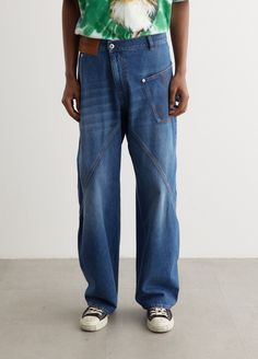 Heavily influenced by the British countryside and pop culture, the brand blends luxury with casual charm using unexpected and bold palettes. The Twisted Workwear Jeans are made from pure cotton, with a twisted design, hammer loop and leather logo patch.  - Rigid cotton denim - Low rise- Belt loops- Zipped fly and button closure- Twisted design with curved seams- Logo detail on pocket- Hammer loop Materials:100% Cotton. Care:Cold machine wash. Sizing: Item has a loose, oversized fit. Model wears a size 32 and is 188cm/6'2". Workwear Jeans, British Countryside, End Of Season Sale, Leather Logo, Jeans For Sale, Oversized Fits, Patch Logo, Pure Cotton, Low Rise