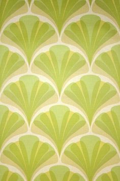 an art deco style wallpaper with green and beige fan design on it's side