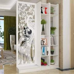 the room divider is decorated with an intricate peacock design and decorative bookshelves