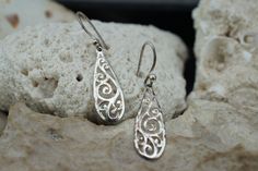 This is the perfect option for those who like cool, unique jewelry and the luxury, shine of silver. The pierced earrings have the shape of drops. The earrings have carved ornament. It is perfect for a gift for birthday, mother's day and holidays. ❤️ The earrings are about 1 2/4'' with loops by 3/8''(in the widest place). ❤️ There is a hallmark: 925. SU.Thailand. ❤️One earring is a little crumpled. Everyone interested in the jewelry should remember that he or she must like their jewelry- not just Unique Sterling Silver Teardrop Earrings For Gift, Silver Teardrop Plug Earrings As A Gift, Silver Plug Earrings As Gift, Unique Sterling Silver Nickel-free Teardrop Earrings, Handmade Silver Teardrop Earrings For Anniversary, Sterling Silver White Gold Teardrop Earrings Gift, White Gold Sterling Silver Teardrop Earrings Gift, White Gold Teardrop Earrings In Sterling Silver As Gift, Silver Sterling Silver Teardrop Plug Earrings