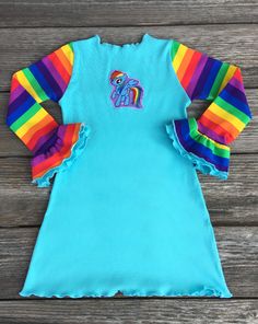 My Little Pony Rainbow Dash Birthday Girl Dress Cute Cotton Dress With Crew Neck, Playful Long Sleeve Playwear Dresses, Playful Long Sleeve Dresses For Playwear, Playful Rainbow Dress With Ruffles, Cute Rainbow Dresses With Ruffles, Cute Rainbow Ruffled Dresses, Long Sleeve Rainbow Dresses For Summer, Long Sleeve Rainbow Summer Dress, Rainbow Long Sleeve Summer Dress