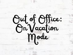 the words out of office on vacation mode written in black ink against a white brick wall