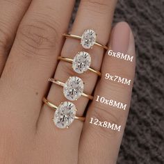 three different sizes of engagement rings on someone's hand with measurements for each ring