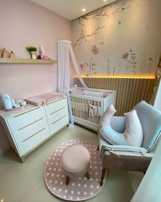 a baby's room is decorated in pink and white