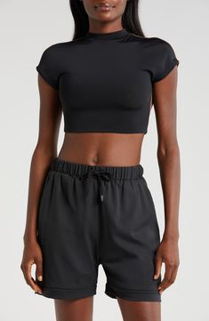 Cut from a double-layer knit with a banded hem, this cropped open-back T-shirt is supportive enough for the weight room and hot enough for the dance floor. Mock neck Short sleeves Nylon/spandex Machine wash, tumble dry Imported Black Athleisure Cropped T-shirt For Workout, Sporty Black Crop Top T-shirt, Basic Crew Neck Crop Top For Sports, Basic Crew Neck Sports Crop Top, Seamless Crew Neck Crop Top For Gym, Seamless Crew Neck Crop Top For Sports, Seamless Crew Neck Crop Top For Workout, Seamless Sports Crop Top With Crew Neck, High Stretch Casual Cropped T-shirt