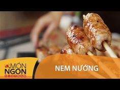 a person is cooking chicken on skewers with the words nem nuong