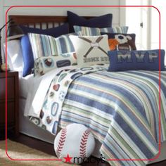 a baseball themed bed in a bedroom