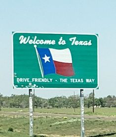 a welcome to texas sign in the middle of nowhere