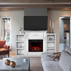 a living room with a fireplace and entertainment center