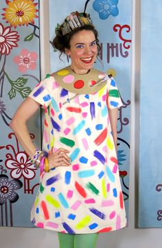 a woman in a clown costume posing for the camera