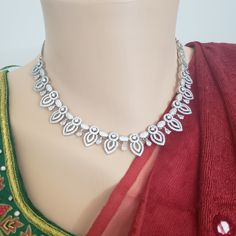 "Gorgeous Handmade Gold Plated Choker Set- American Diamond Necklace Set comes with Earrings. This stunning delicate Piece is made of American Dimonds Handmade Indian Jewelry, best to wear for traditional ceremonies or Indian weddings. This bridal jewelry has an ethnic finish. It has Cubic Zircon stones with ruby and emeralds. It is a Bollywood style one-gram jewelry. Handmade Indian Jewelry item * Necklace Set is a combo of Necklace & Stud Earrings * Necklace is adjustable with adjustable b Dazzling Bridal Necklace For Celebration, Teardrop Jewelry With Intricate Design For Party, Festive Silver Bridal Necklace With Sparkling Stones, Celebration Bridal Necklace With Sparkling Stones, Festive Silver Cubic Zirconia Necklace, Teardrop Party Jewelry With Intricate Design, Traditional Jewelry Sets With Sparkling Stones For Gifts, Traditional Teardrop Jewelry With Elegant Design, Festive Silver Necklace With Sparkling Stones