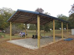 a covered parking lot in the middle of a park