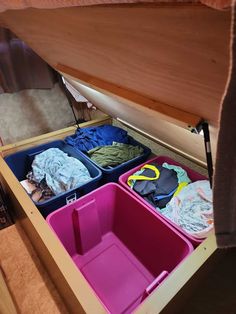 an open drawer filled with lots of clothes