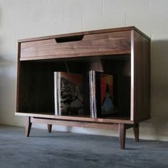 a book shelf with two books on it