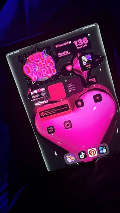 a pink heart shaped computer mouse on top of a black surface with the words out of order now above it