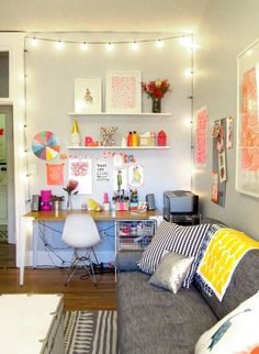 a living room filled with furniture and lots of clutter on top of the table