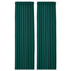 two dark green curtains with pleated edges on the top and bottom, in front of a white background