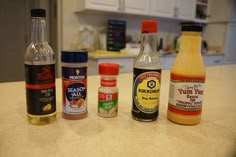 an assortment of condiments on a kitchen counter