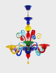 a multicolored chandelier hanging from a ceiling fixture with three lights on each side