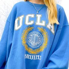 Vintage Ncaa Ucla Bruins Logo Sweatshirt, Ucla Bruins Shirt, University Of California, Shirt For Men Women, Unisex Shirt, Vintage Shirt ,Mtyhr Our Classic T-Shirt Serves As The Perfect Short-Sleeved Shirt For Your Unique, Funny, Or Personalized Designs. Brand: Gildan Heavy Weight Fabric Classic Unisex Makes This An Easy Fit Size Up If You Want Something Roomier Our Shirts Materials: 100% Cotton ** Note: - Double Check Your Address Before Ordering. - If You Want To Return The Goods, You Are The O Blue Graphic Print Sweatshirt For Campus, Blue Collegiate Sweatshirt For Campus, Varsity Blue Sweatshirt For Campus, Blue Varsity Tops For Campus, Blue Varsity Sweatshirt For Campus, Blue Varsity Top For Campus Wear, Blue Crew Neck Top For Campus, Blue Tops For Campus In Fall, Blue Letter Print Sweatshirt For Sports Season