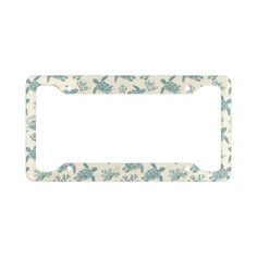 a blue and white license plate frame with sea turtles on the front, against a white background